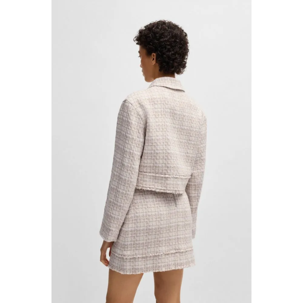 Cropped tweed jacket with metallic buttons